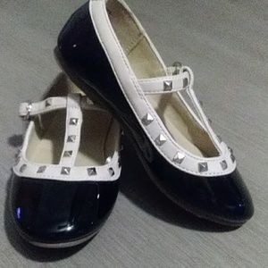 Black and tan studed flats.